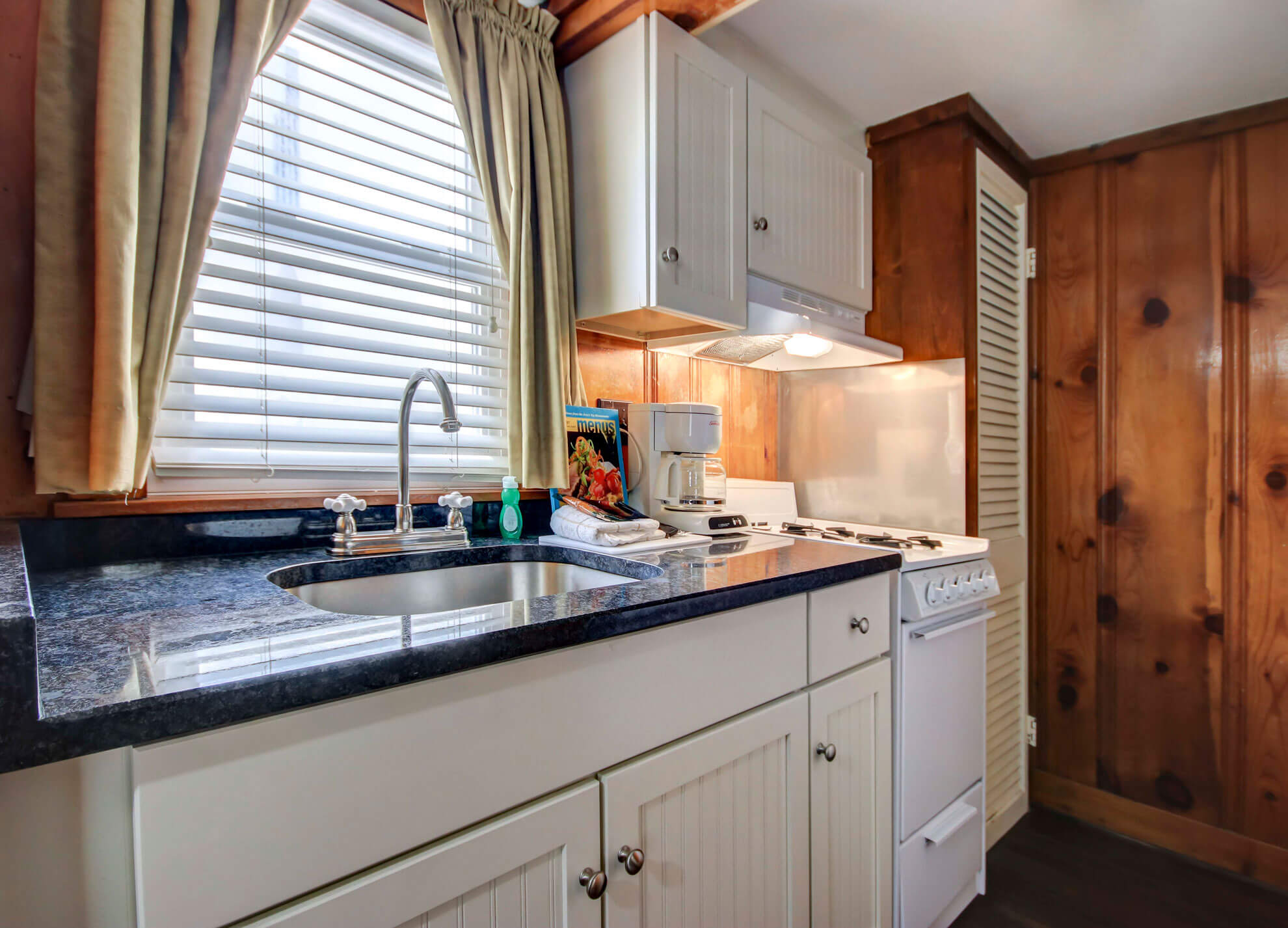 a kitchen with a sink and a window