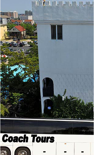 a tour bus parked in front of a building