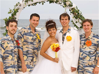 a group of people standing next to each other on a beach