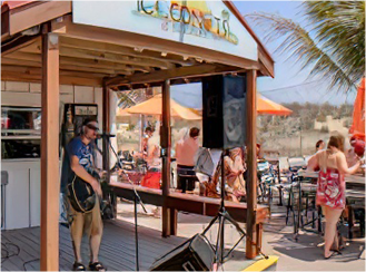 a group of people standing around a food stand