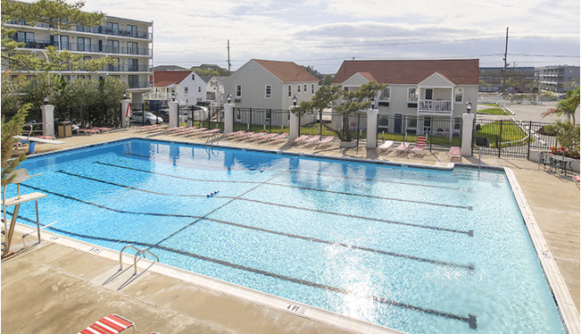 a large swimming pool surrounded by apartment buildings