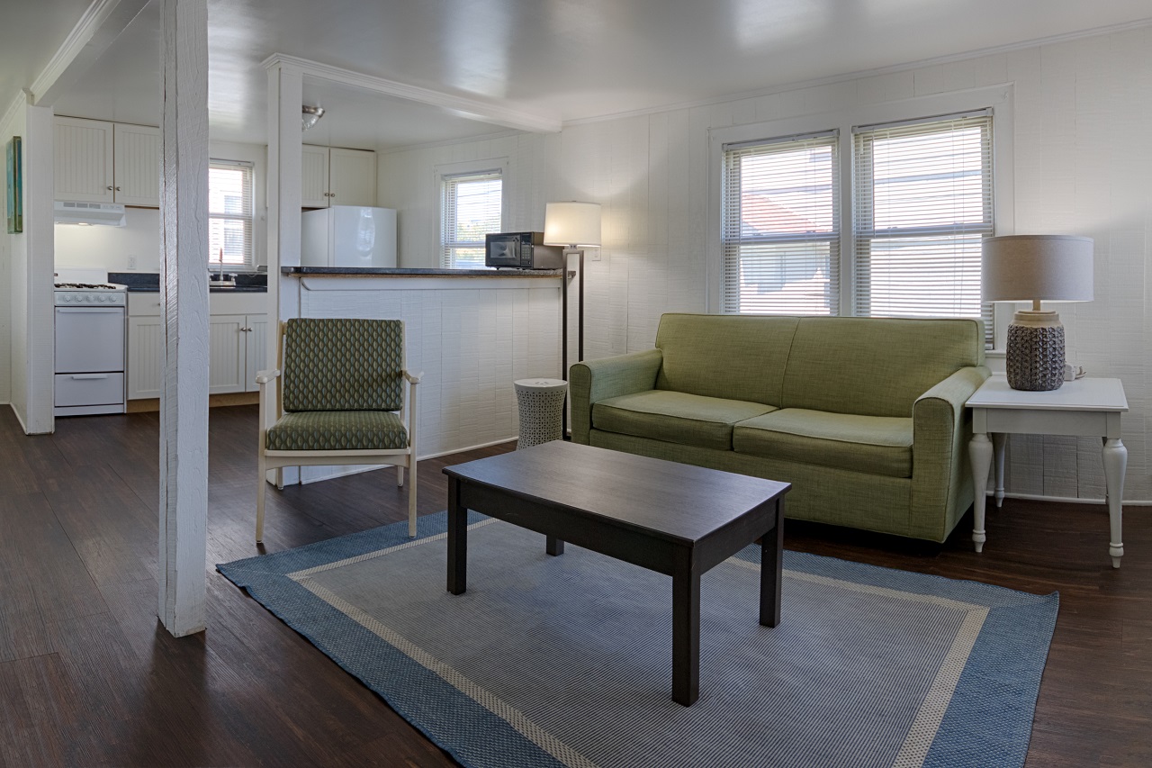 a living room filled with furniture and a flat screen tv