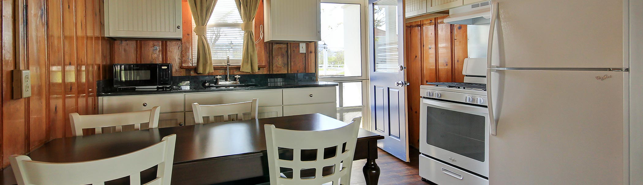 a white refrigerator freezer sitting inside of a kitchen