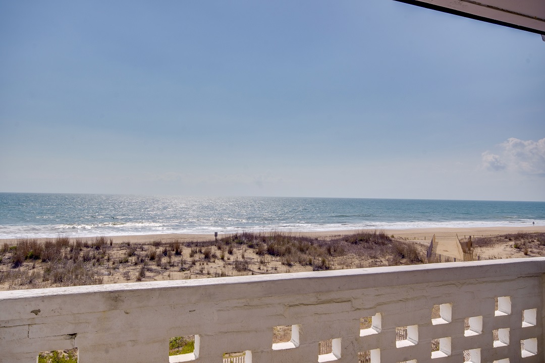 a view of the beach from a balcony