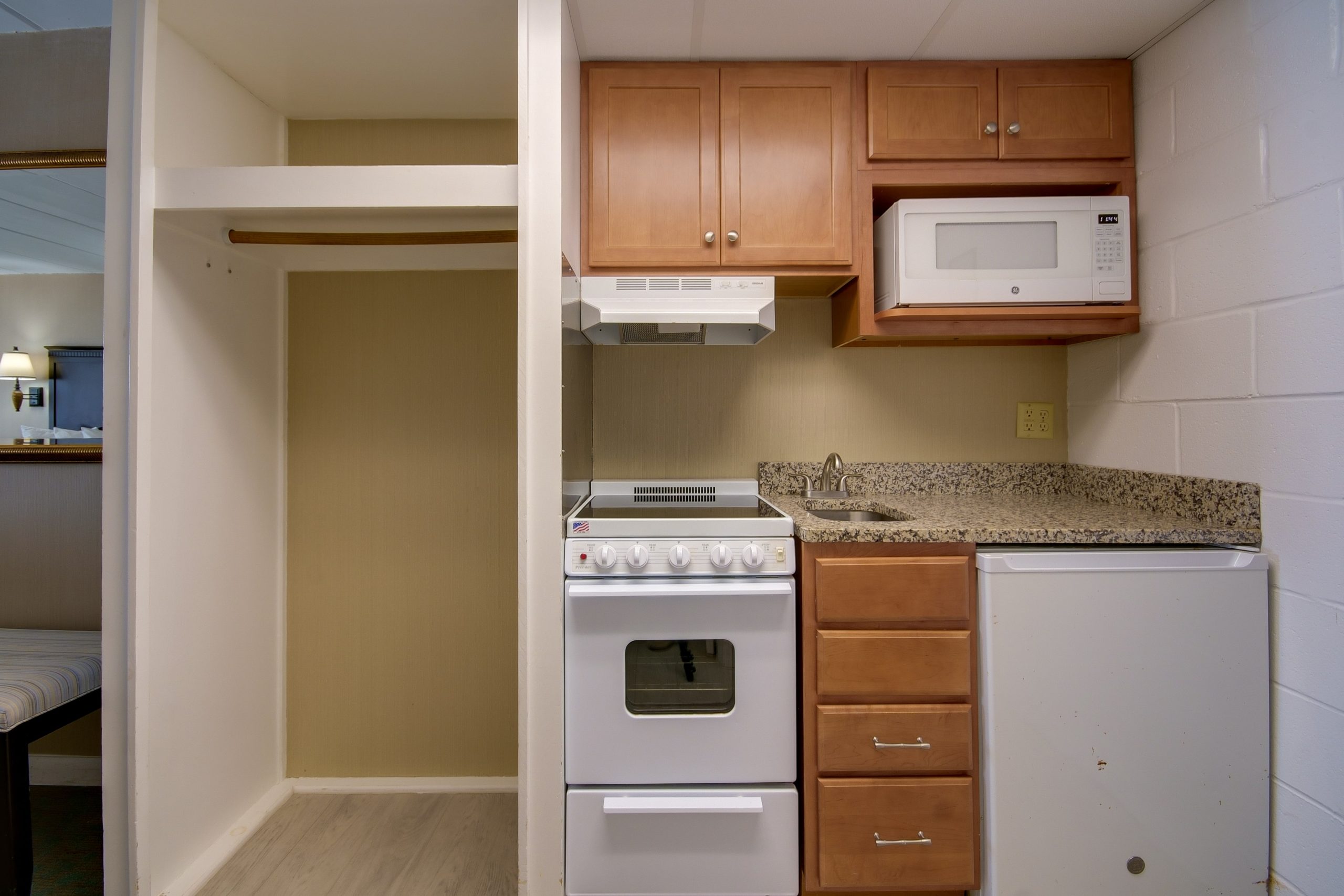 a kitchen with a stove top oven and microwave