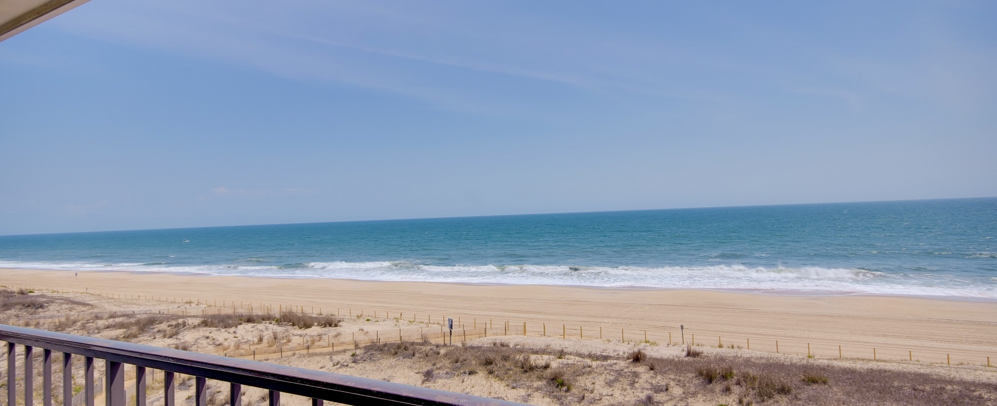 a balcony with a view of the beach