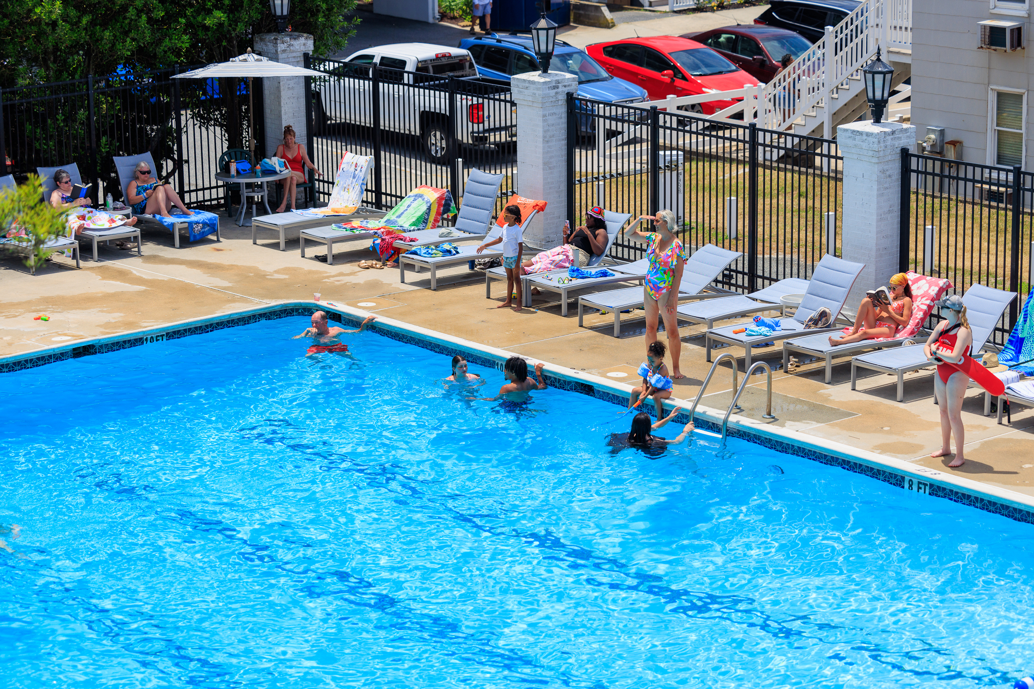 a swimming pool with people playing in it