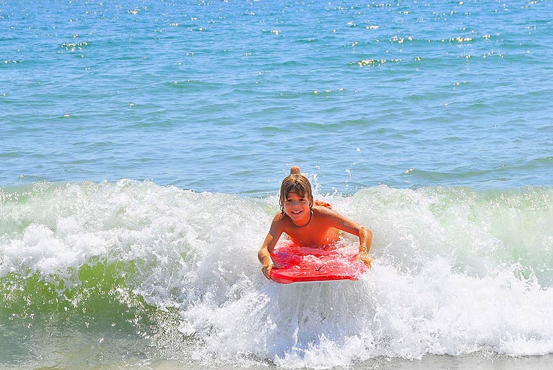 a person riding a surf board on a wave in the ocean