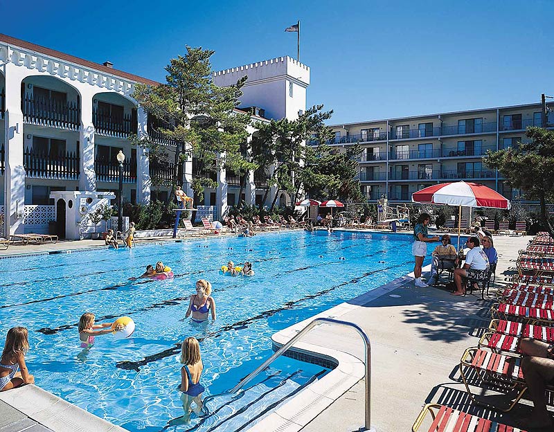 a large swimming pool with people in it